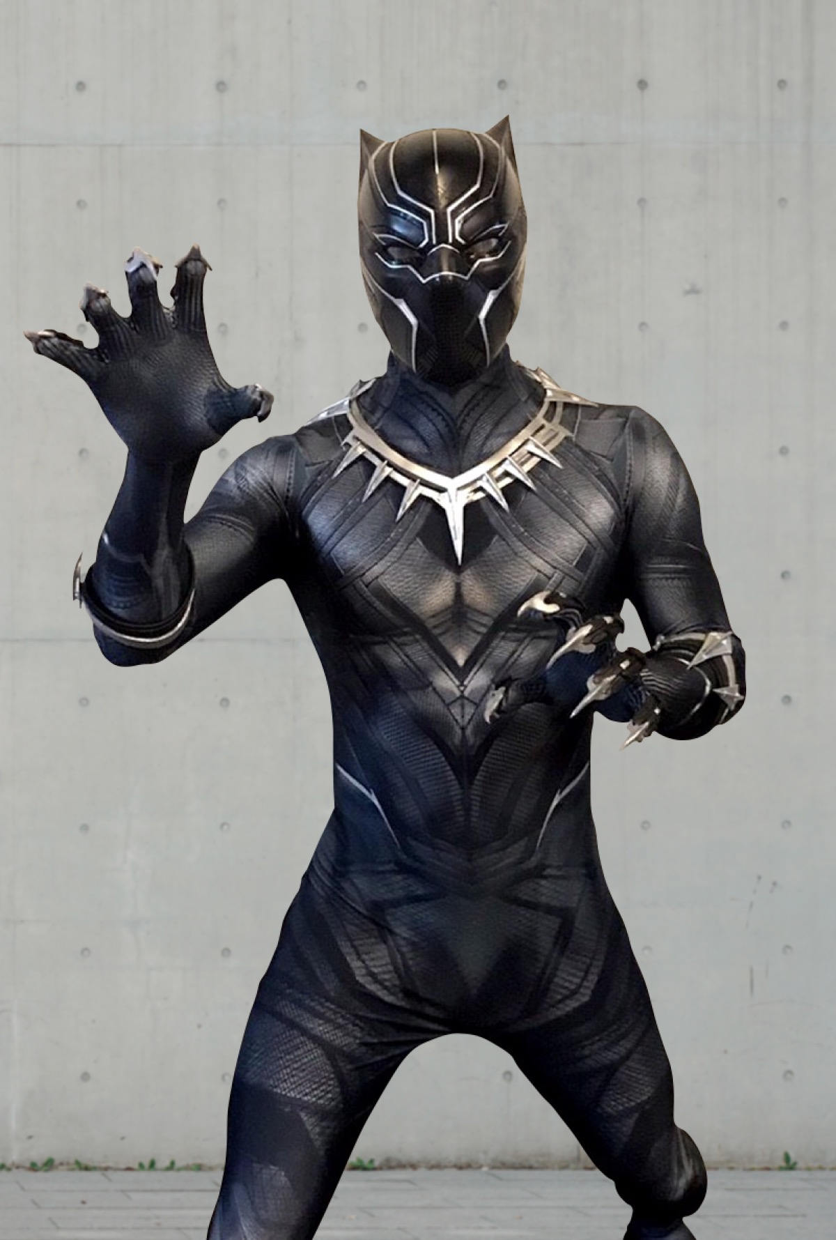 Black Panther superhero character at a children's birthday party with kids