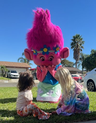 Hire Poppy from Trolls for birthday parties - colorful mascot character performer in Houston